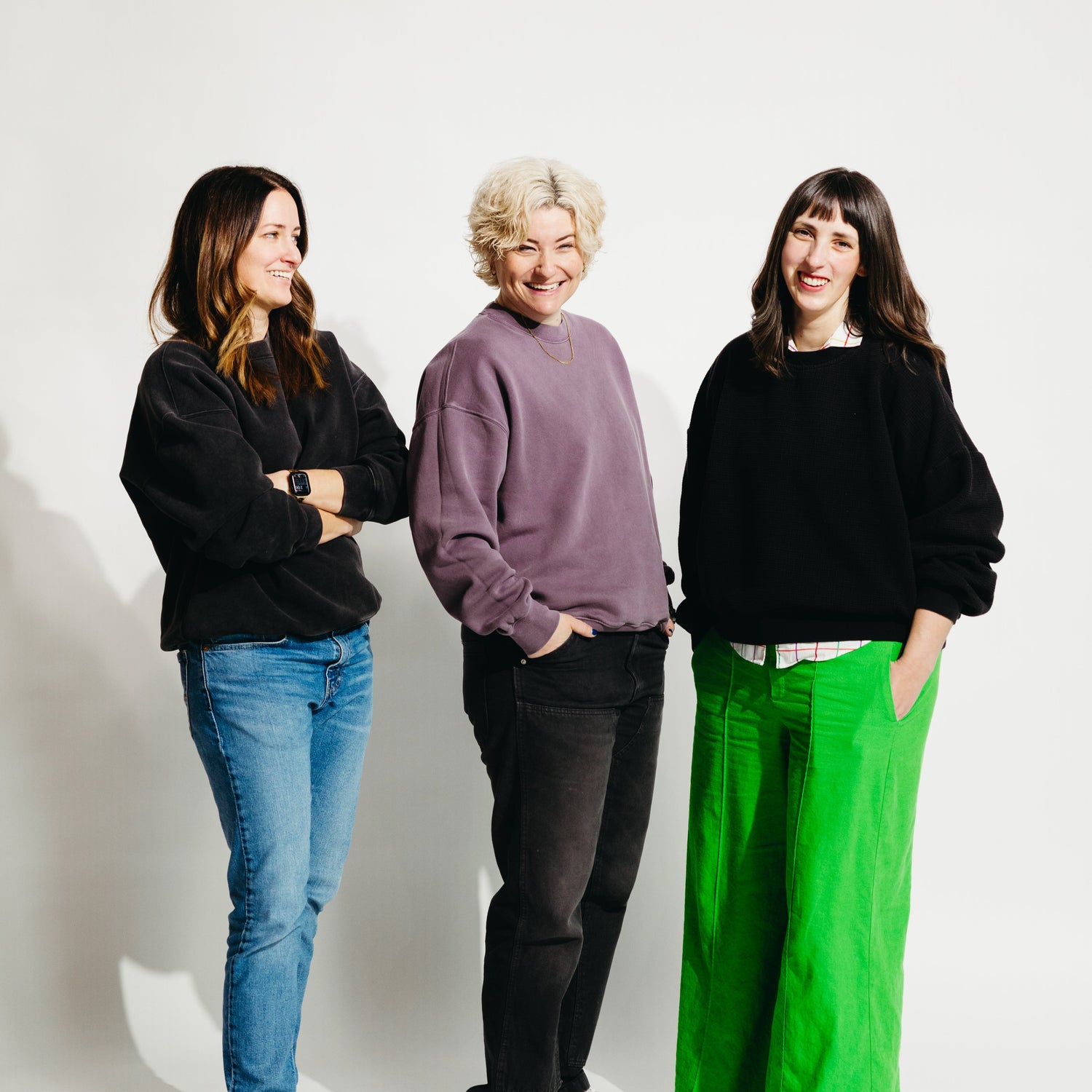 Culture Flock's team–Brittany, Summer, & Kendra–against a white backdrop