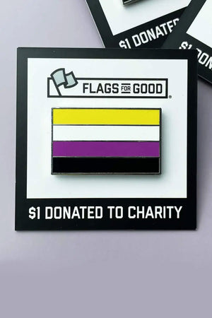 Enamel pin on a black and white card backing. The pin is of the Nonbinary Pride Flag. The flag features horizontal stripes of Yellow, white, purple, and black.