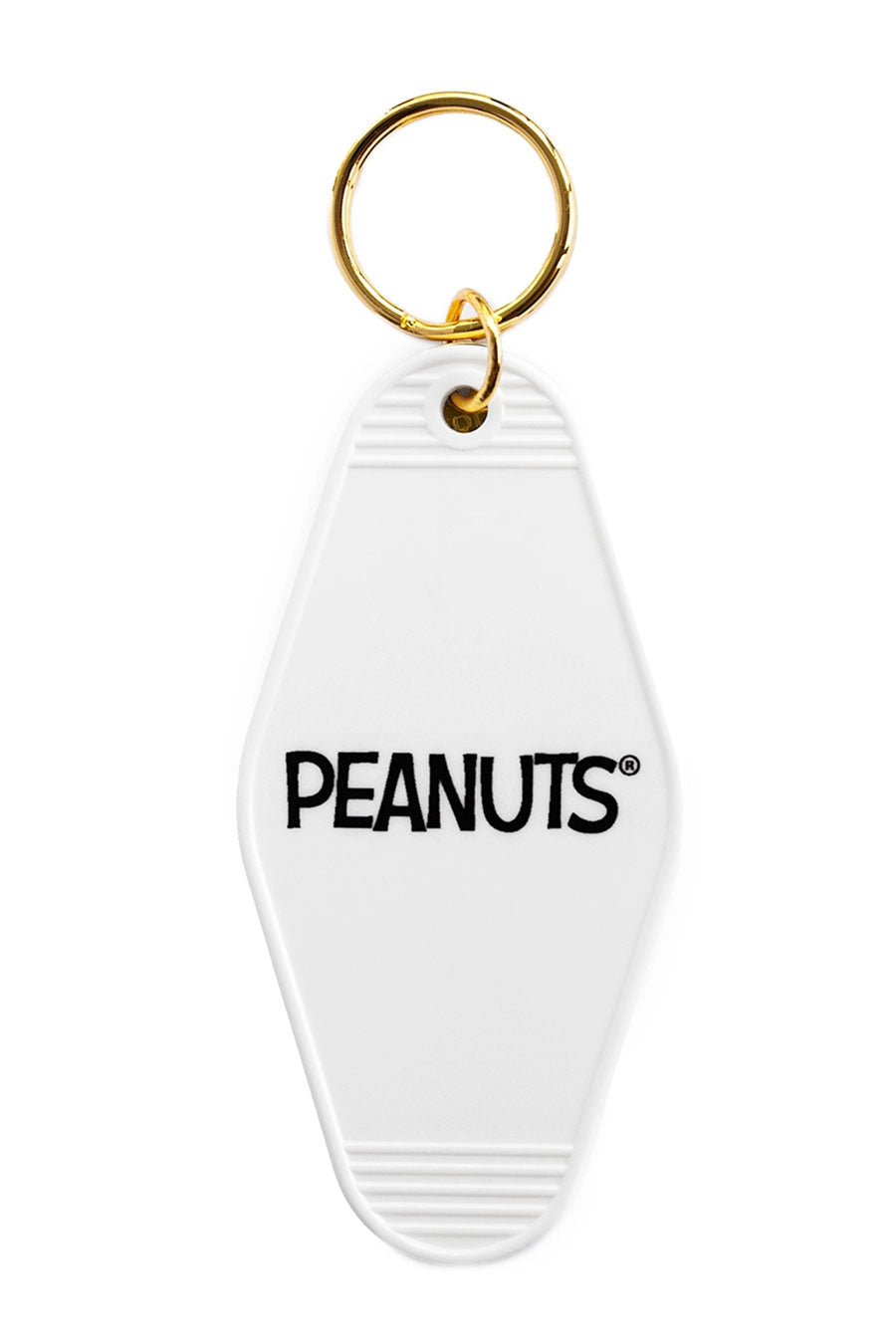 The back of a vintage Motel style keychain. The keychain says Peanuts and has gold hardware. White background.