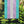 Load image into Gallery viewer, Garden flag on a pole. The flag is the Transgender Pride flag with blue, pink, and white stripes.
