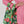 Load image into Gallery viewer, A person holding a Reusable shopping bag covered with a photo of red flowers and leaves all over it. White background.