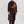Load image into Gallery viewer, Person wearing brown crescent shaped fanny pack with black straps across their chest. White background.
