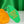 Load image into Gallery viewer, Green vintage motel style keychain. The keychain is leaning against a small piece of cheese in front of a green satin background. The keychain says Cheese Loves You Bakc in yellow lettering.