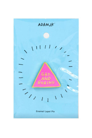 Pink triangle enamel pin that says Gay and Boring on a blue backing card. White background.