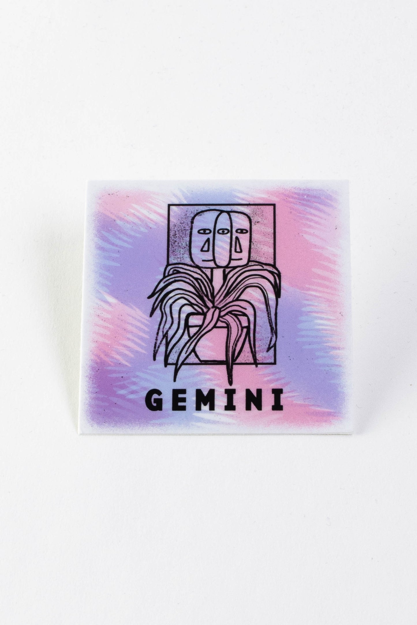 A square sticker with a purple and pink background and an illustration of two faces growing out of a potted plant. The text reads "Gemini."
