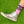 Load image into Gallery viewer, Photograph of someones leg wearing silver shoes and midcalf pink crew socks that say "Hot Homo" across the top. The socks have a black stripe above and below the text. Grass background.