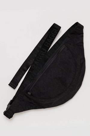 Black nylon crescent shaped fanny pack with black straps.