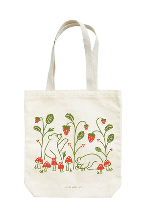 Tote bag featuring illustration of Strawberry plants being picked by bears surrounded by red toadstool mushrooms.
