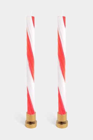 Pair of twisted rope candles in red and white candy cane stripes. 