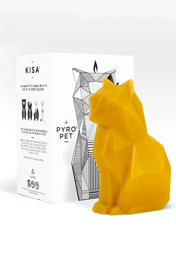Yellow geometric cat shaped candle in front of the box that it comes in. The white box says Pyro Pet and features an illustration of the skeletal frame that is revealed as the candle melts. White background.