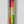 Load image into Gallery viewer, Set of three taper candles hand dyed in green, lime, and pink neon colors.
