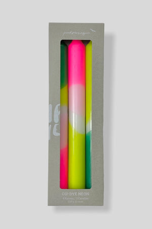 Set of three taper candles hand dyed in green, lime, and pink neon colors.