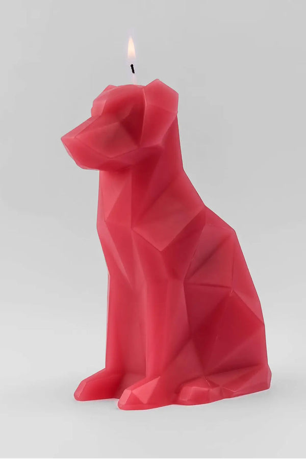 Berry color geometric candle in the shape of a dog. White background.