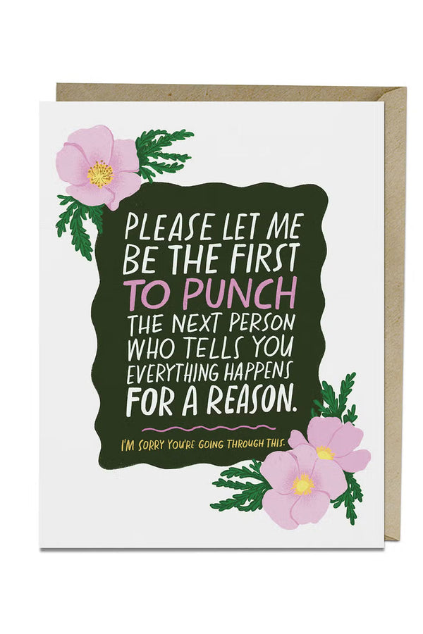 Greeting card that says "Please let me be the first to punch the next person who tells you everything happens for a reason. I'm sorry you're going through this." The text is surrounded by pink flowers. White background.