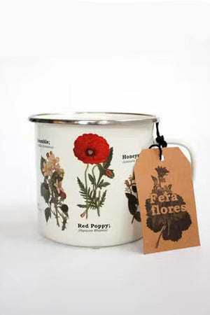 Enamel mug featuring botanical artwork of flowers and herbs that include their scientific names next to them.
