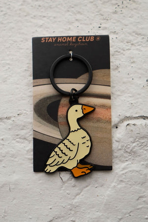 Enamel keychain with black hardware of a white duck.