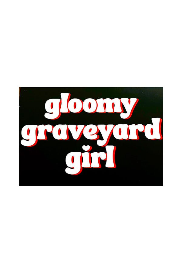 Black rectangle sticker that says gloomy graveyard girl in white text with red shadowing.  White background,