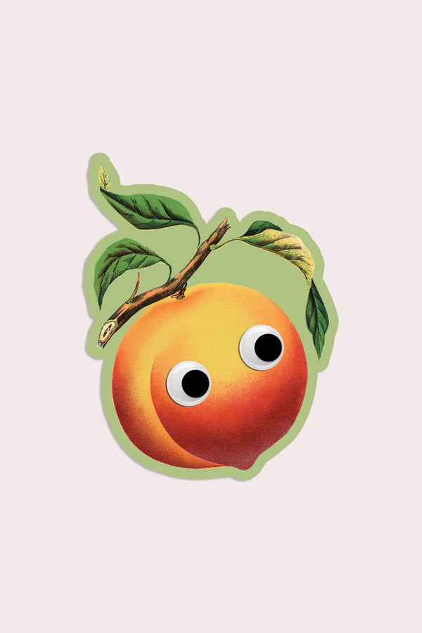 Vinyl sticker of a peach with googly eyes.