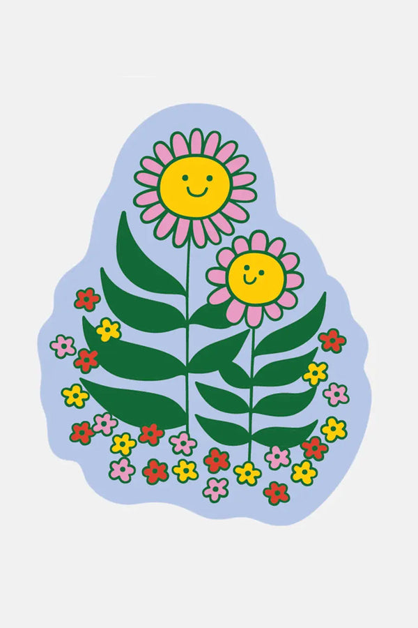 Blue die cut sticker of two happy flowers surrounded by smaller flowers.