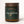 Load image into Gallery viewer, Candle in amber glass jar with forest green label. Label features an illustrated jumping fox and says Wilder &amp; CO, The Hunter.
