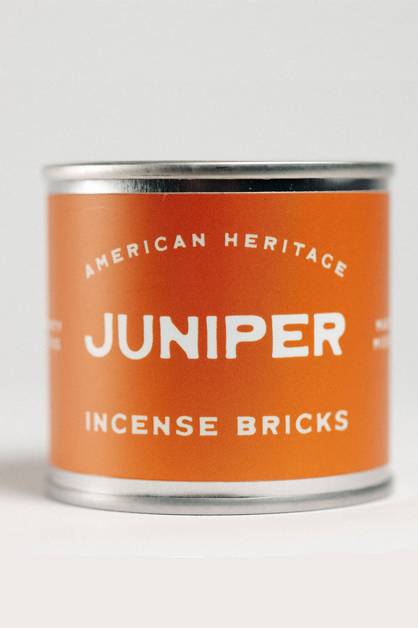 Small tin of incense bricks. The label is orange and says American Heritage Juniper Incense Bricks.