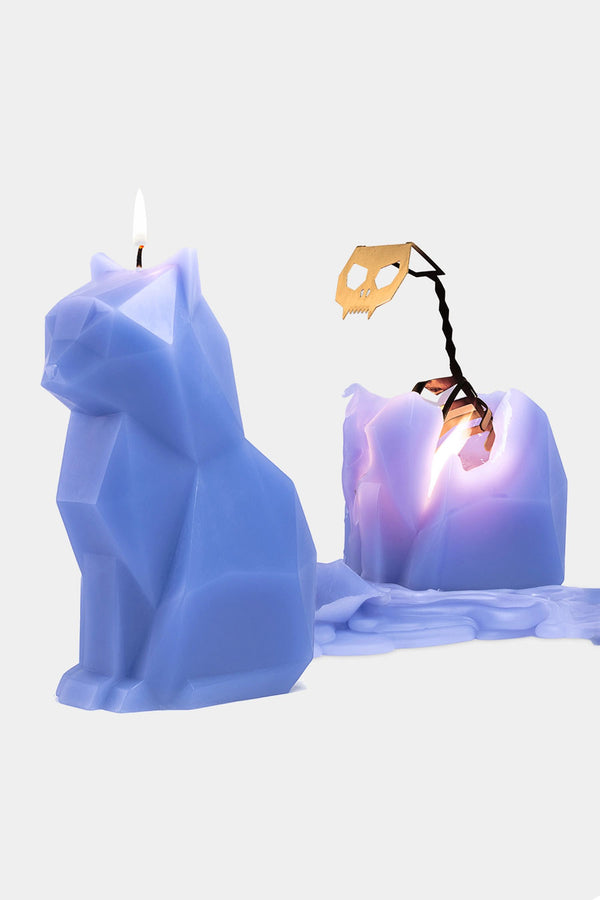 Lavender geomentric cat shaped candle. Next to that is a melted version of the candle revealing a metal skeletal frame inside.