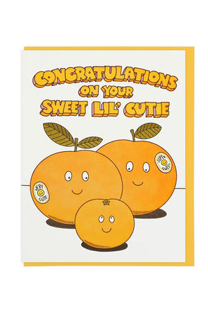 Greeting card of two cutie oranges with a small orange in between them. Orange envelope. White background.