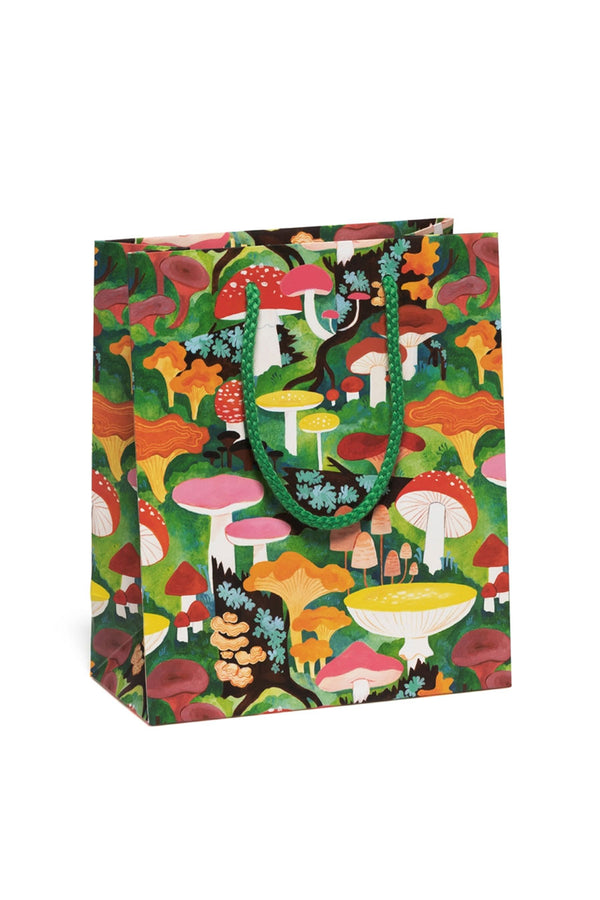 Gift bag of illustrated multicolor mushrooms in the forest printed all over. Green rope handle.