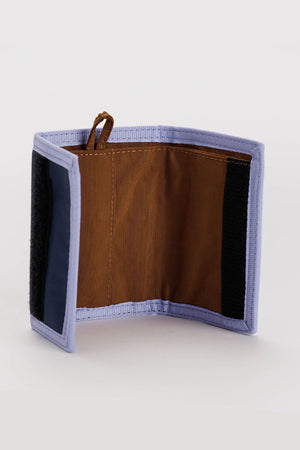 Nylon wallet in navy with orchid color trim. Brown nylon interior.
