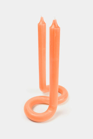 Orange twist candle with two Wicks.