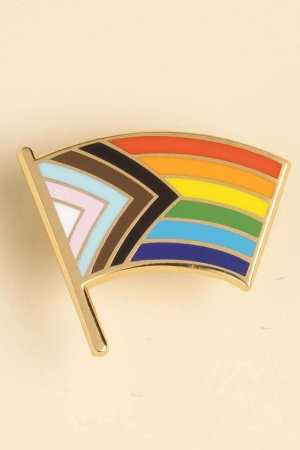 Enamel pin of the Progress Pride flag.