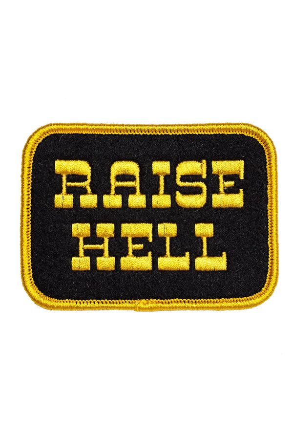 Black rectangle patch with rounded yellow edges. The patch says Raise Hell in yellow text 