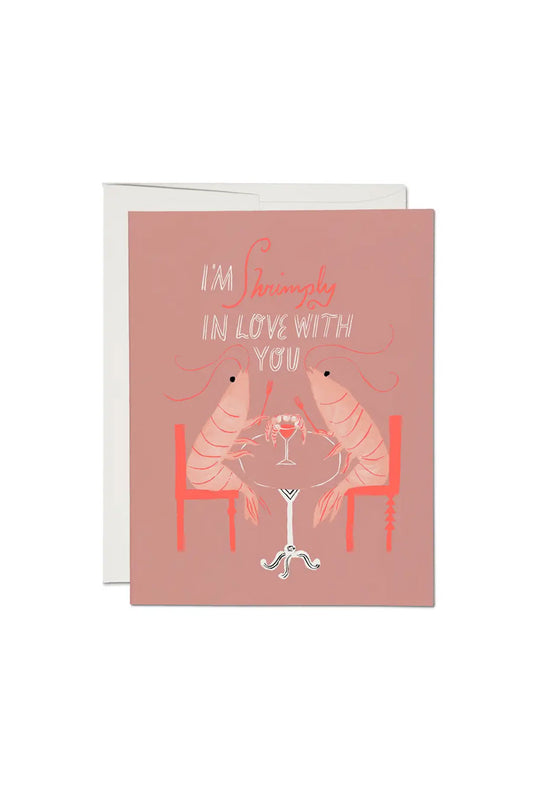 Greeting card of two Shrimp dining at a table with Shrimp cocktail. Card says I'm Shrimply In Love with You