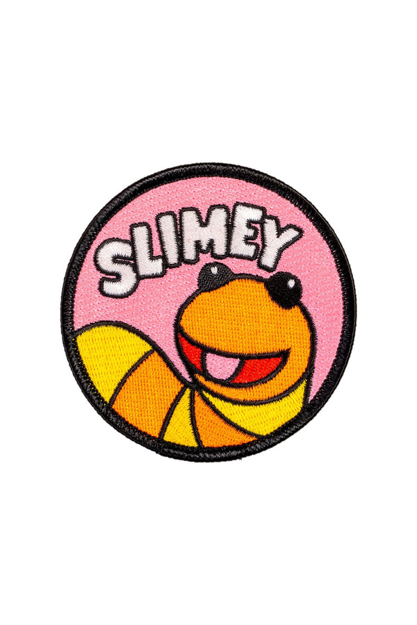 Embroidered circle patch of Slimey the worm from Sesame Street.