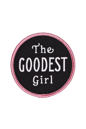 Black Circle patch with pink border. The patch says The Goodest Girl in white lettering. White background.