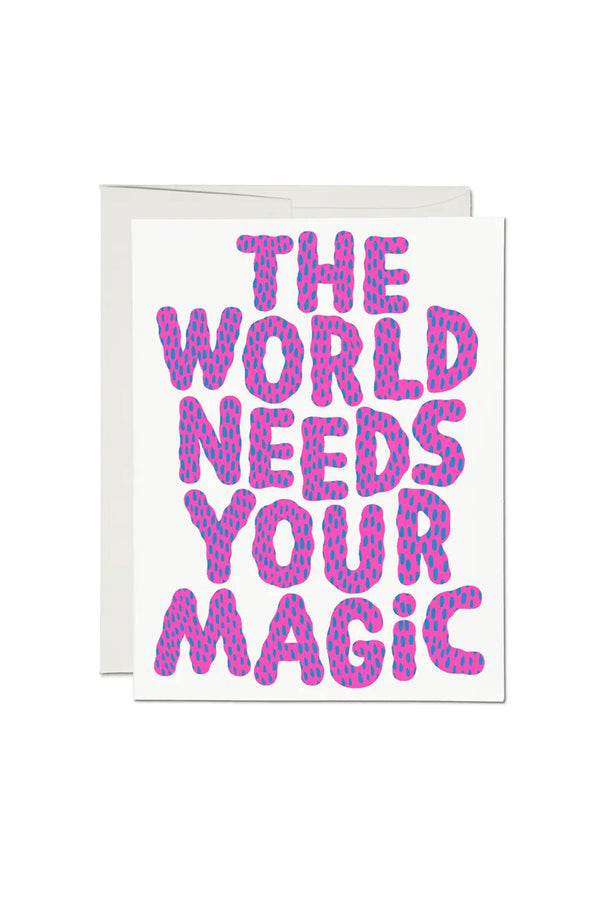 Greeting card that says The World Needs Your Magic in pink bubble text with blue dots.