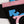 Load image into Gallery viewer, Photo of a close up of the black pennant with pink edge and blue tails. The pennant features the transgender symbol in Blue, Pink, and white.

