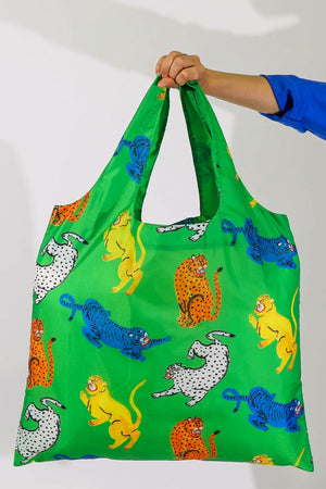 Green reusable tote bag covered in yellow, blue, white, and orange tigers, cheetahs, and other large wild cats.
