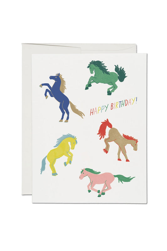 Greeting card of 5 multicolor wild horses. Card says Happy birthday in rainbow colors.