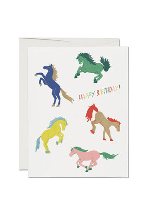 Greeting card of 5 multicolor wild horses. Card says Happy birthday in rainbow colors.