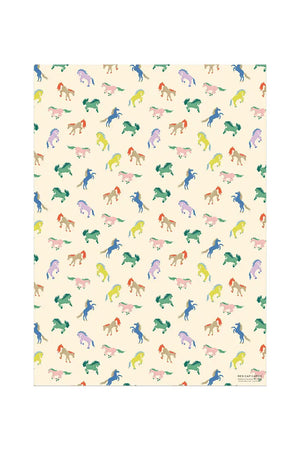 Wrapping paper featuring multicolor wild horses on an off white background.