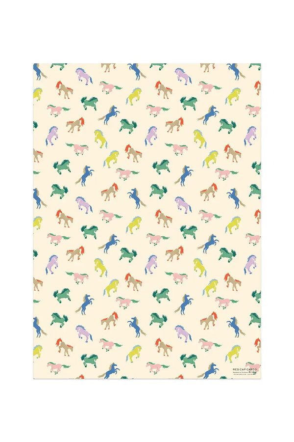 Wrapping paper featuring multicolor wild horses on an off white background.