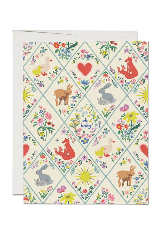 Greeting card with a diamond quilt pattern. In each diamond space there are different Mother and Baby animals. Card says Oh Baby!