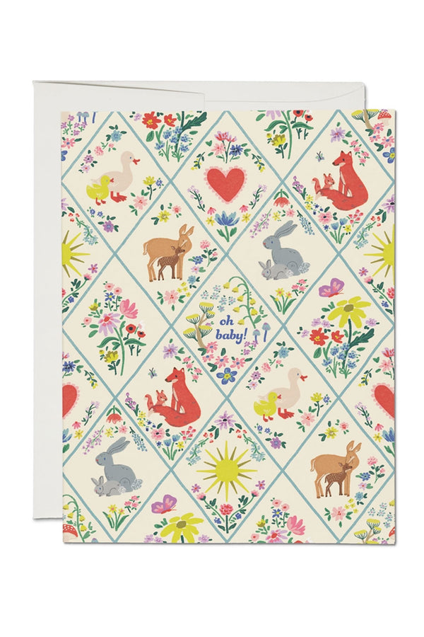 Greeting card with a diamond quilt pattern. In each diamond space there are different Mother and Baby animals. Card says Oh Baby!