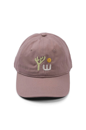 Dad ball cap in Hazy Rose color featuring a lone Yucca plant under the sun.