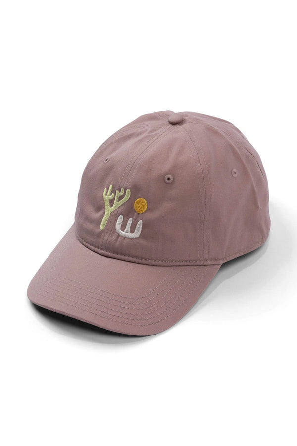 Dad ball cap in Hazy Rose color featuring a lone Yucca plant under the sun.