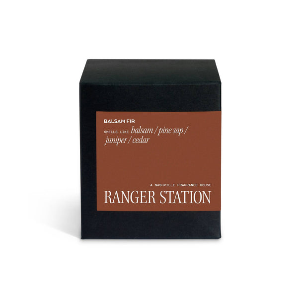 Black candle box with brown label that says Ranger Station A Nashville Fragrance House. The scent is Balsam Fir.