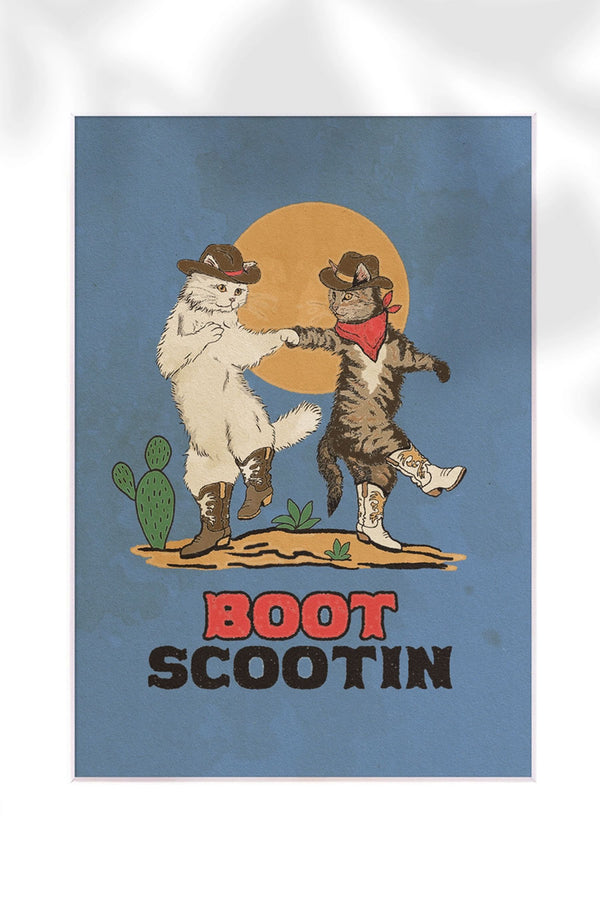 Blue poster of two cats wearing cowboy boots and hats dancing against a sun in a desert scene. Underneath the print says Boot Scootin in western style text. White background.