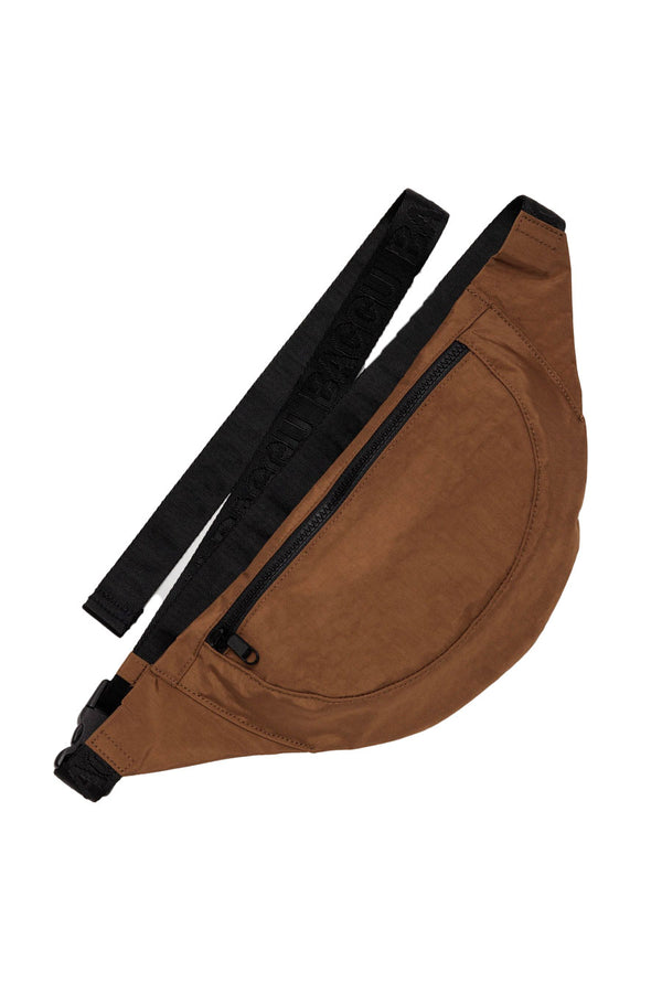 Brown crescent shaped fanny pack with black straps. White background.