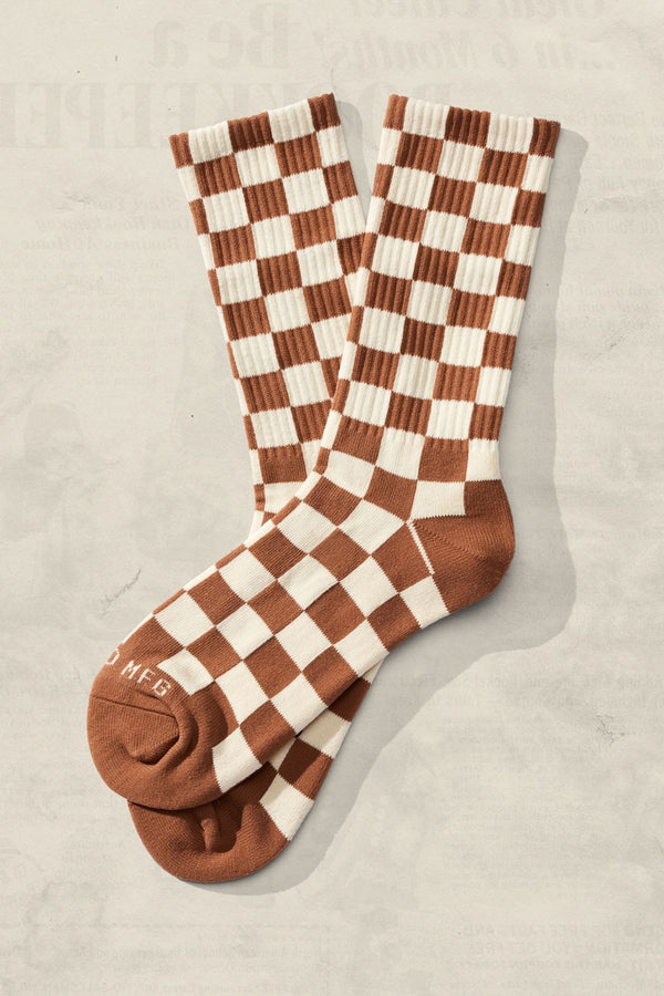 Checkerboard crew socks in cream and rust brown.